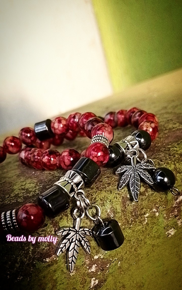 Tie dye reddish yellow beads with leaf charms and purple steel beaded bangles