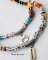 Multicolored pearl and plastic beaded necklaces with metal charms.